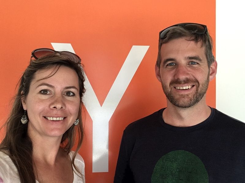 Nathan Holmberg and Alyona Medelyan in front of the Y Combinator sign
